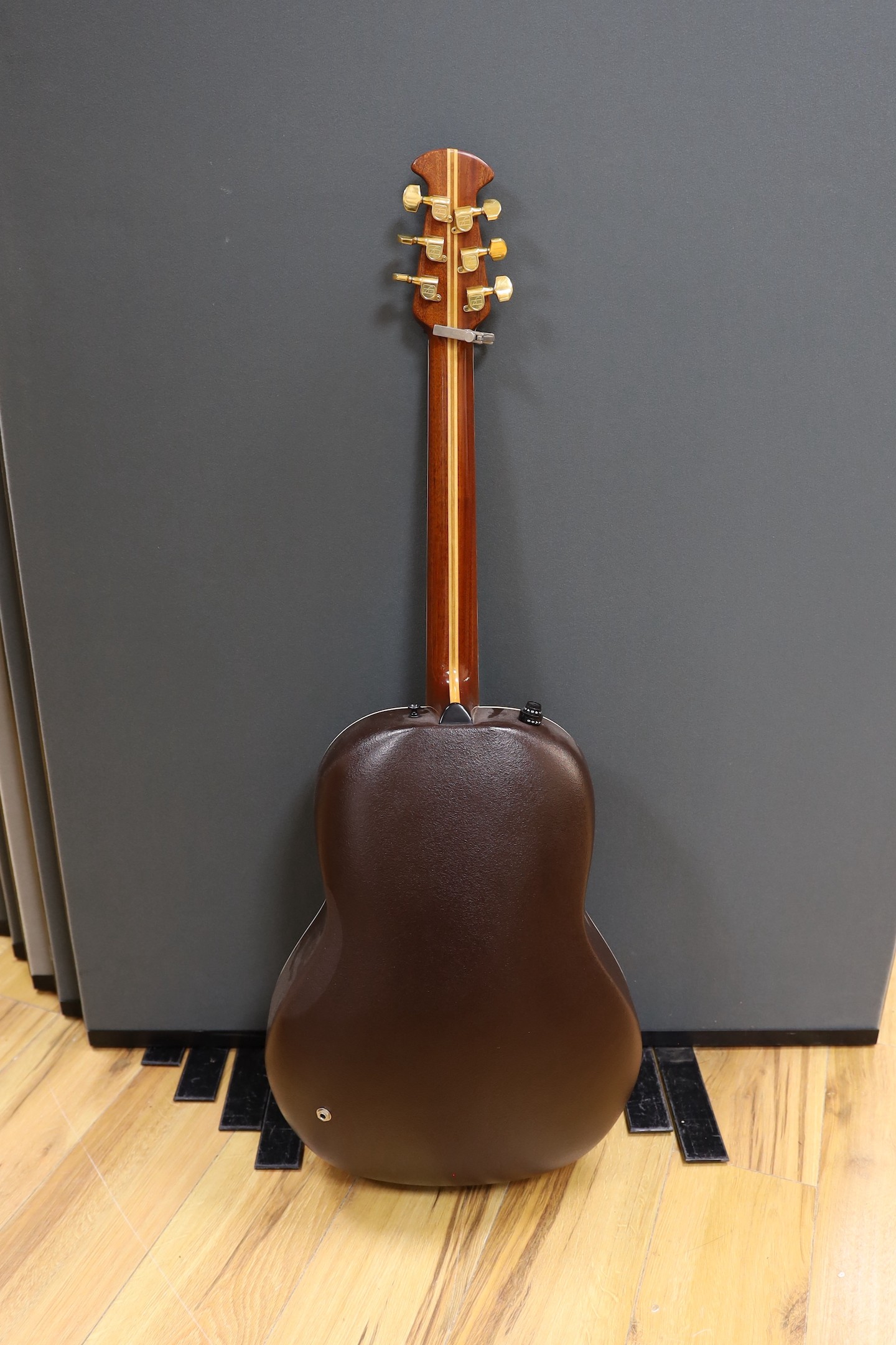 An Ovation acoustic guitar in case